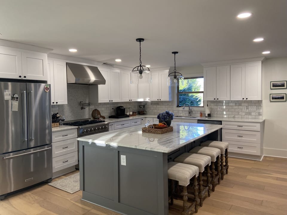 Fully stocked Kitchen with additional seating for 4