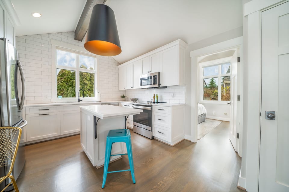 Kitchen adjacent to private bedroom.