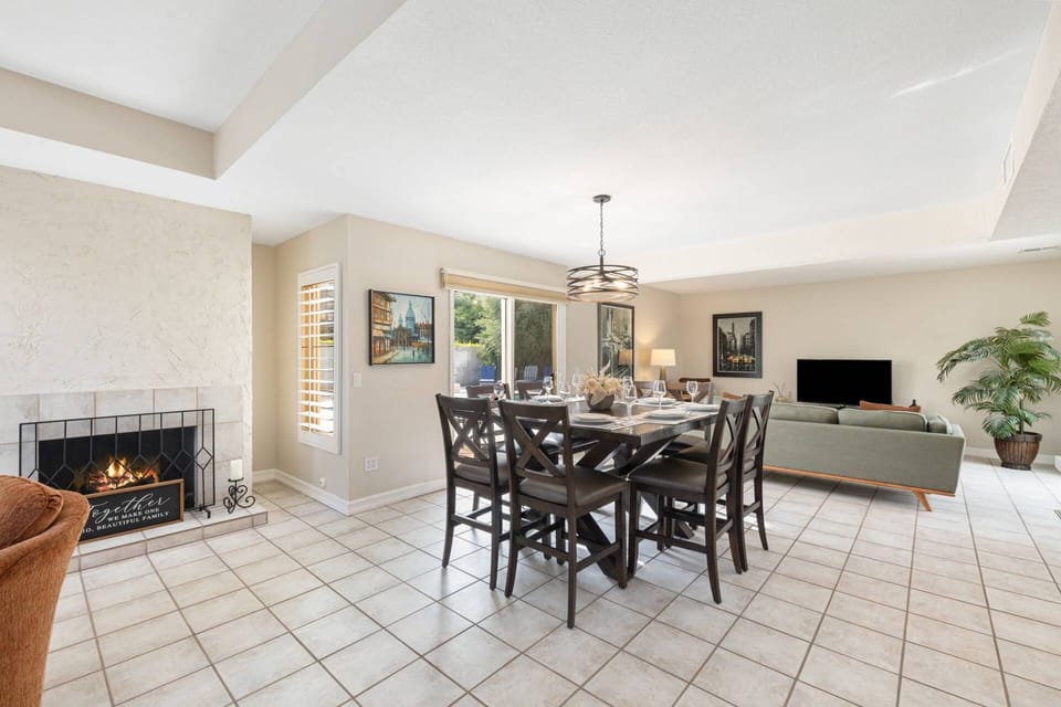 Enjoy seamless flow from dining to living, complete with a charming fireplace.