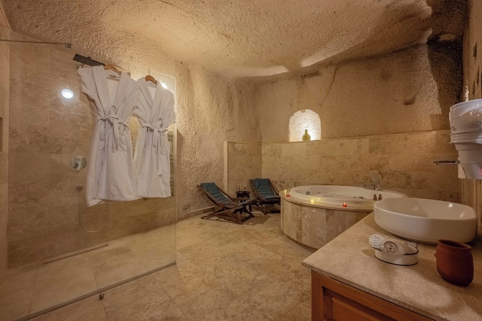 Jupiter - Fully Cave & Jacuzzi | Bathroom | Hair dryer, slippers, towels, soap