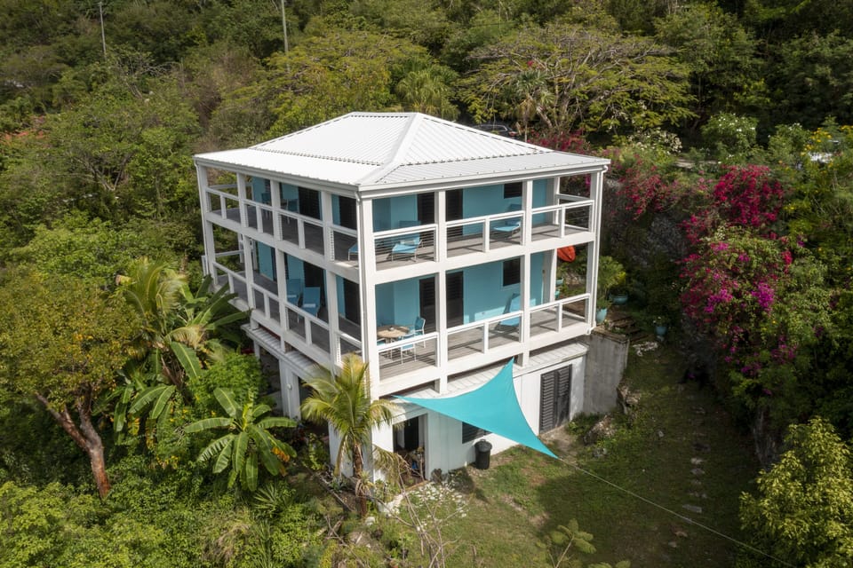 The reconstructed house has two guest accommodations and our caretakers' apt.