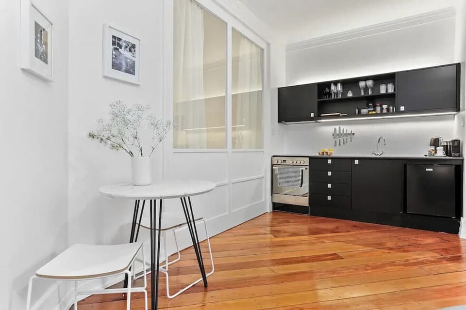 Start your morning at the charming bistro-style dining nook, steps from the fully equipped kitchen in this beautifully curated Heritage Hotel apartment in Auckland CBD.