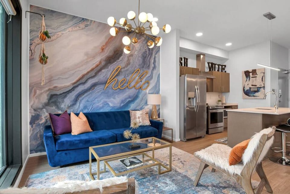 Spacious living room withSpacious living room with pullout couch and patio facing outdoor pool! Smart TV with all the apps you could want. Air Mattress also available. pullout couch and patio facing outdoor pool! Smart TV with all the apps you could want.