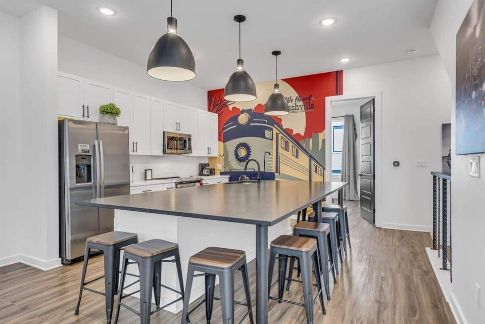 Kitchen with generous space and a central island accommodating 7.