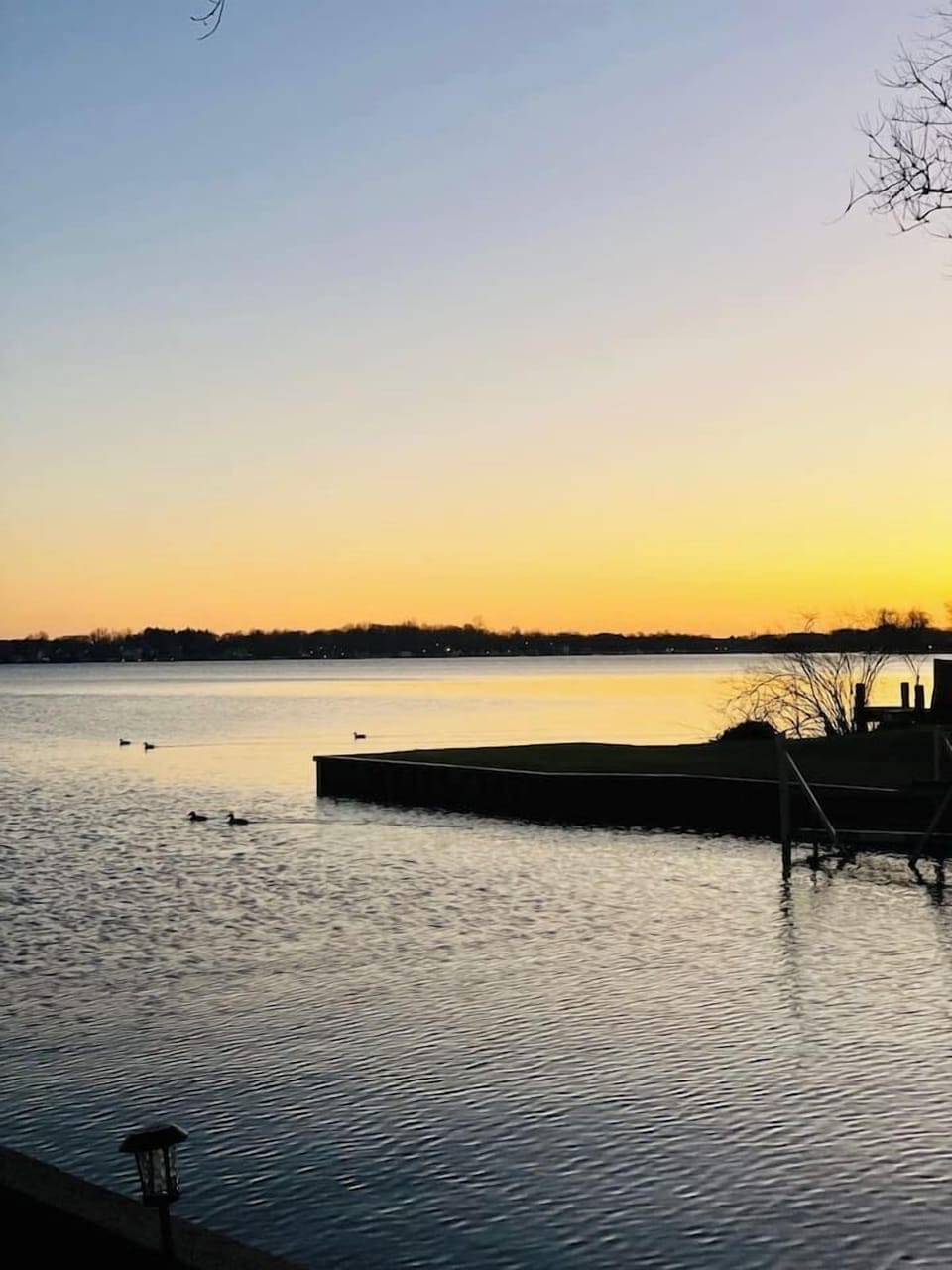 Peaceful lake view of the home stretching across Paw Paw Lake.
