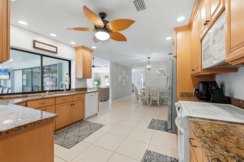 large, fully-equipped kitchen overlooking the lanai & pool