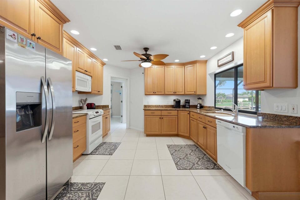 large, fully-equipped kitchen overlooking the lanai & pool