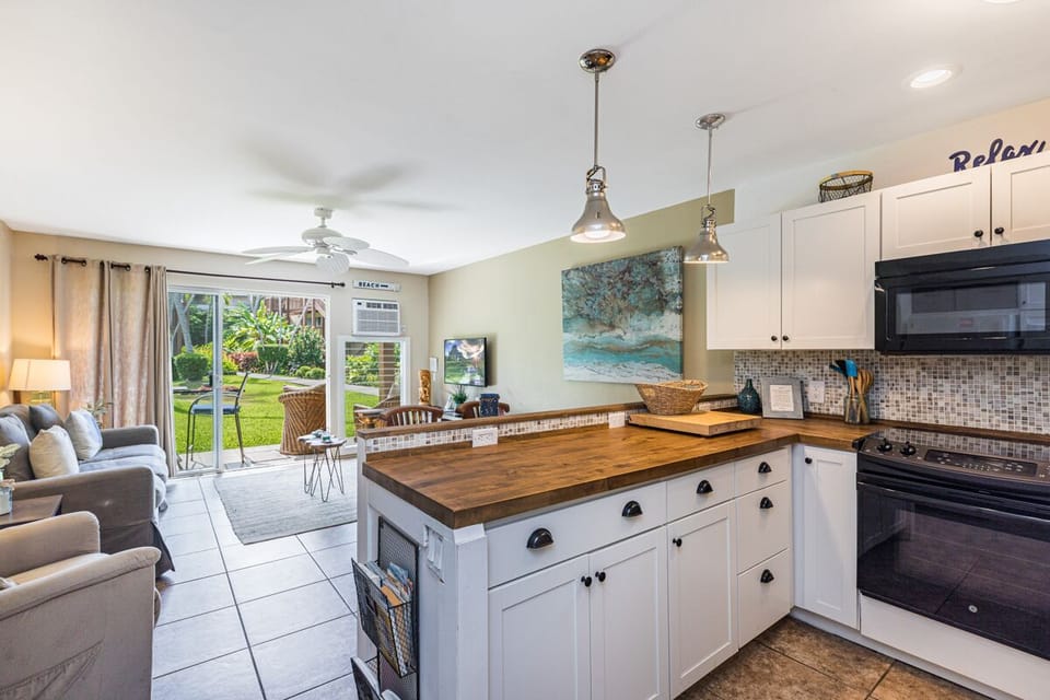 Kitchen in the forefront looking to the Lanai
