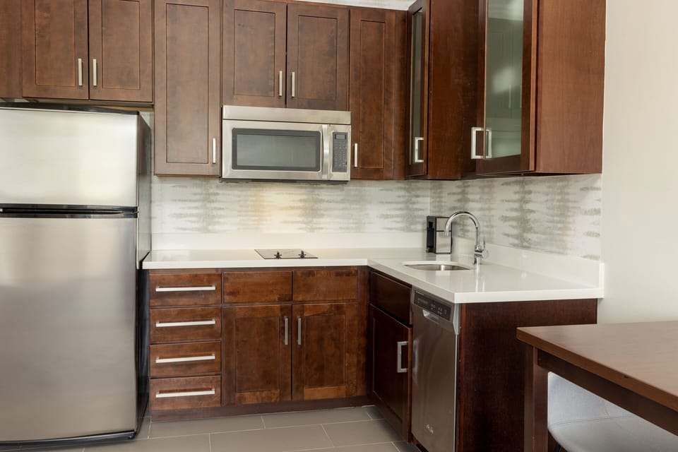 Suite, 1 King Bed with Sofa bed | Private kitchen | Fridge, microwave, stovetop, dishwasher