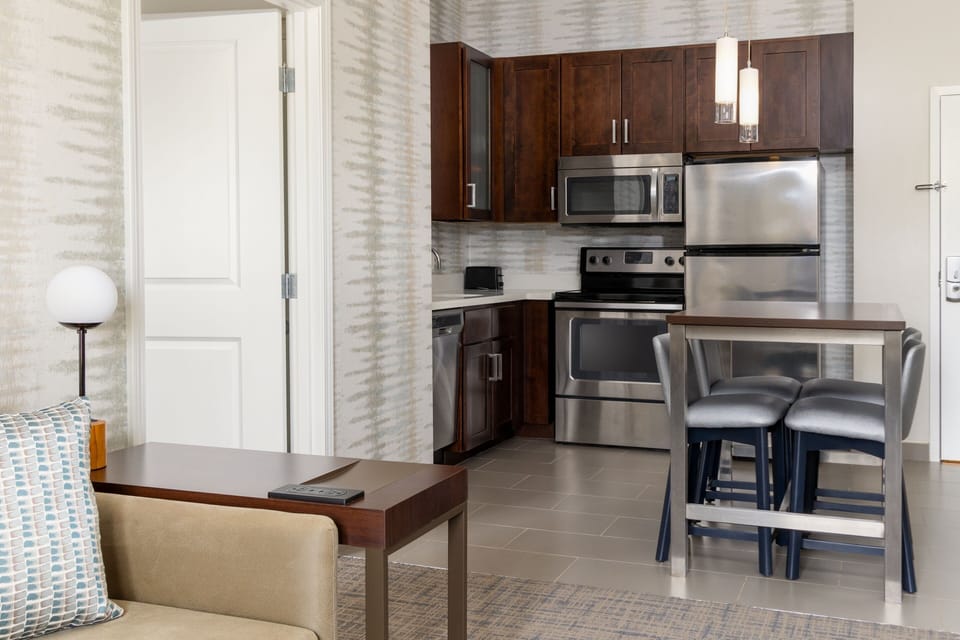 Suite, 1 Double Bed | Private kitchen | Fridge, microwave, stovetop, dishwasher