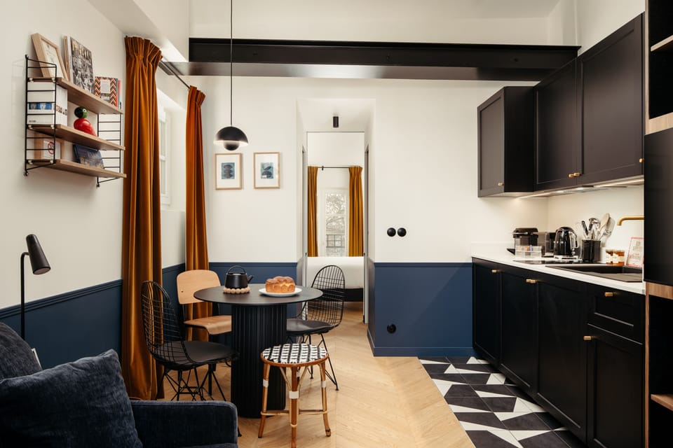 Deluxe Apartment | Private kitchen | Espresso maker, coffee/tea maker, electric kettle, dining tables