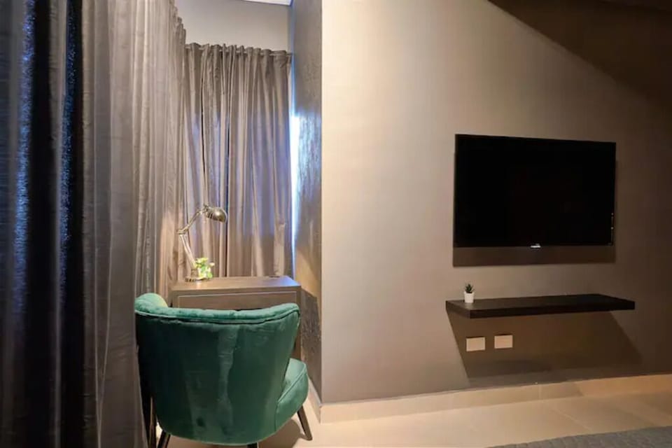 The Luxurious Spacious Master Bedroom Comes with a King Size Bed & bathroom.