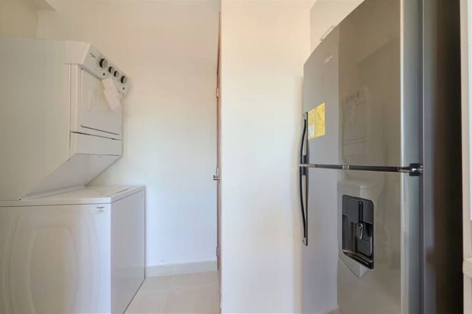 The Spacious Fully Equipped Kitchen is filled with all the utensils you need.