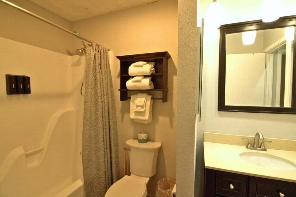 Private Bathroom with a bath/shower combo.