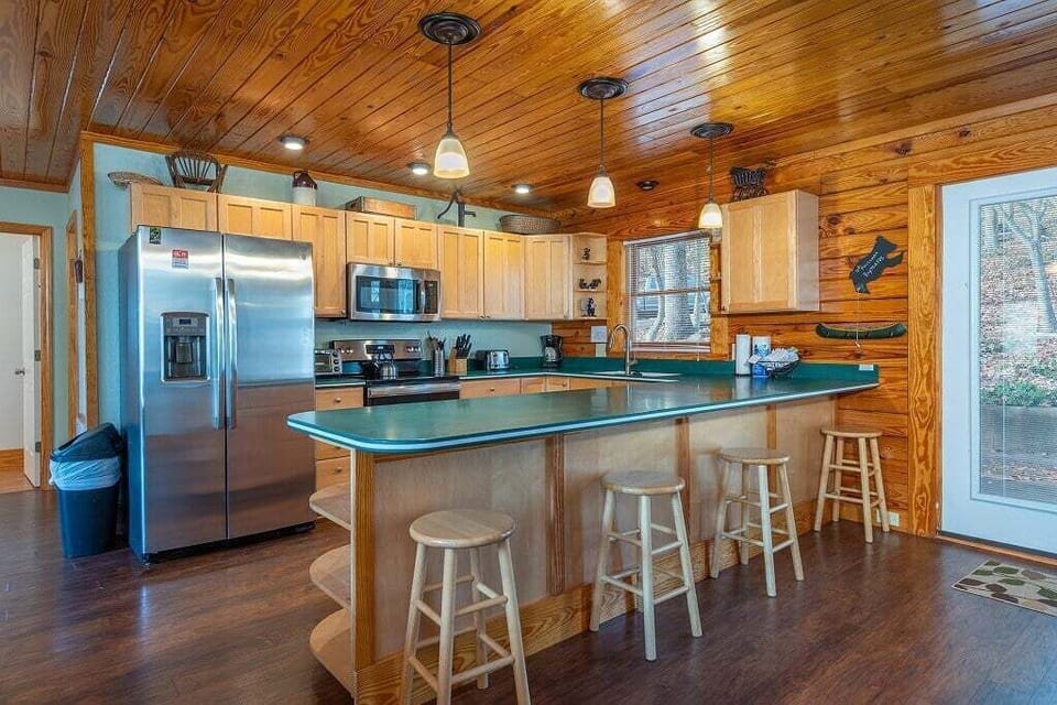 Overhead lights give this kitchen the perfect light for creating and cooking meals.