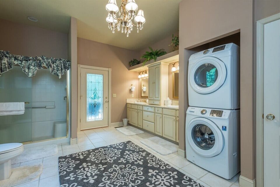 Laundry area in en suite bathroom. includes a walk-in shower