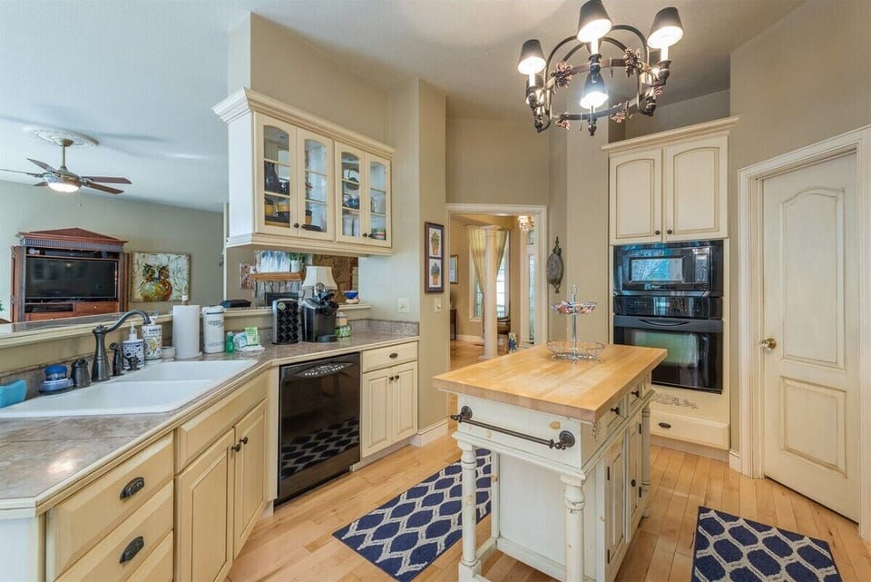 Fully equipped kitchen includes a microwave, stove/oven, refrigerator, dishwasher, and a keurig coffee maker.