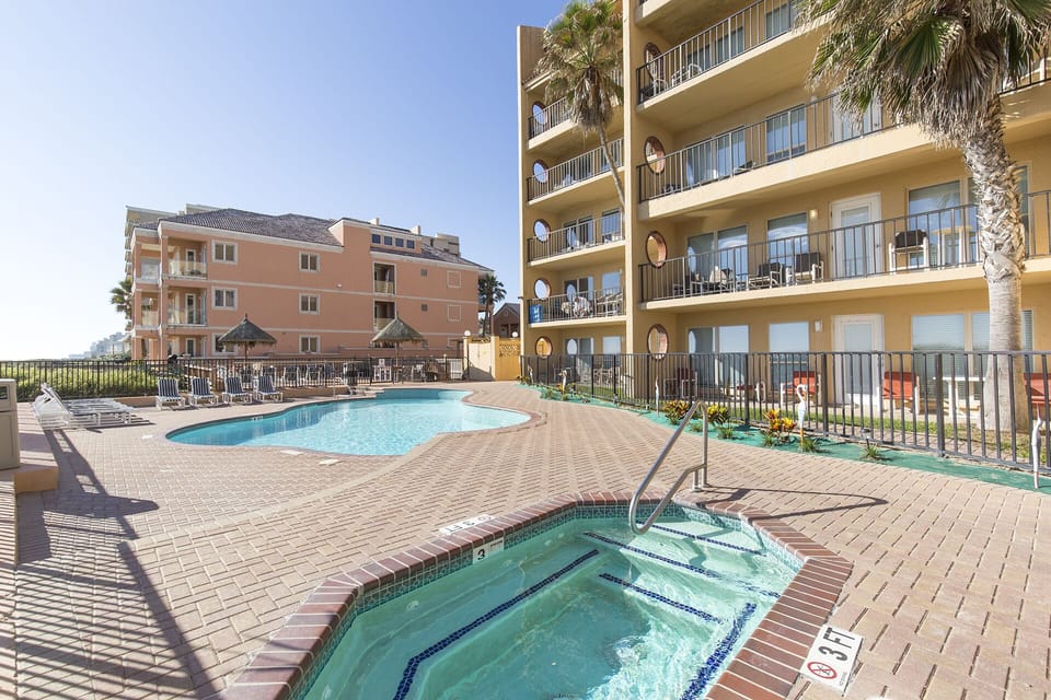 There is plenty of space on the back patio with a pool, hot tup and sun bathing areas.