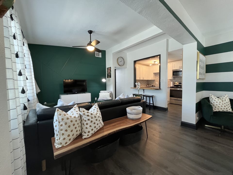 open concept living room w/ vaulted ceilings (view from dining room)