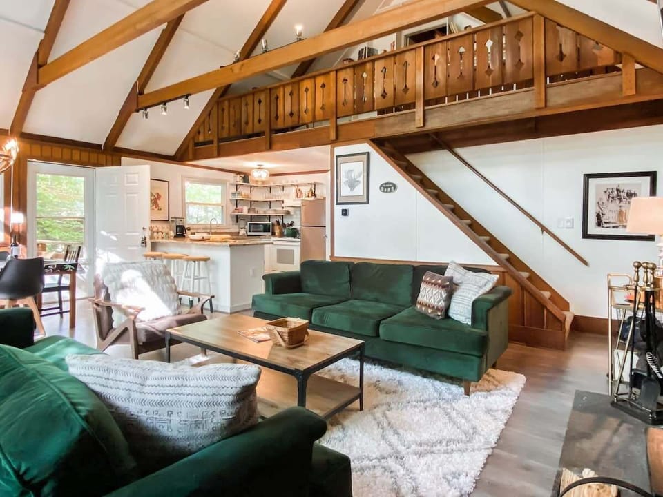 The 2nd floor main living room has access to the primary king bedroom in the loft.