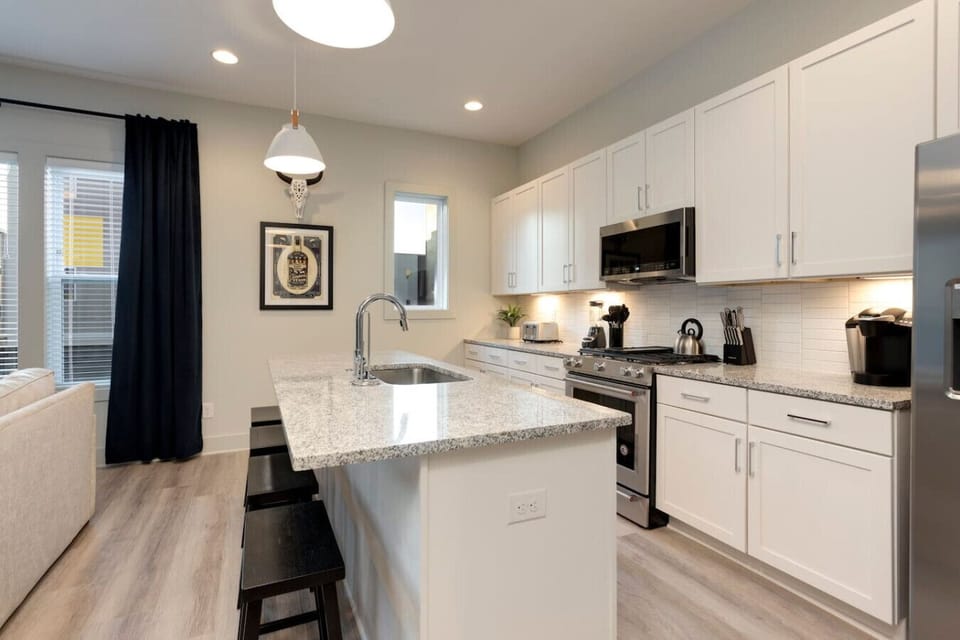 The open-concept living and kitchen layout makes entertaining and group stays effortless.