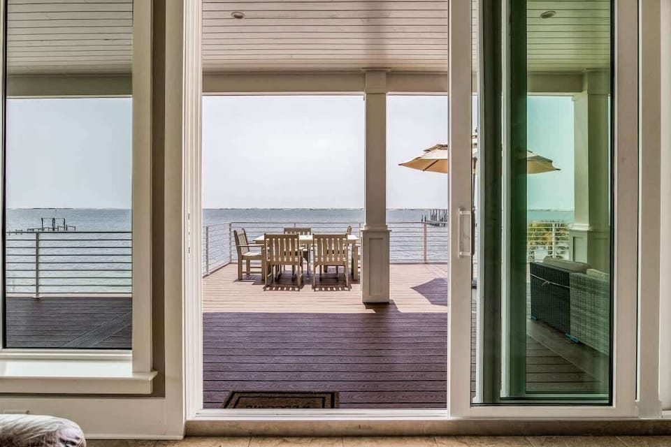 Glass sliding doors create ease to step into your private deck.