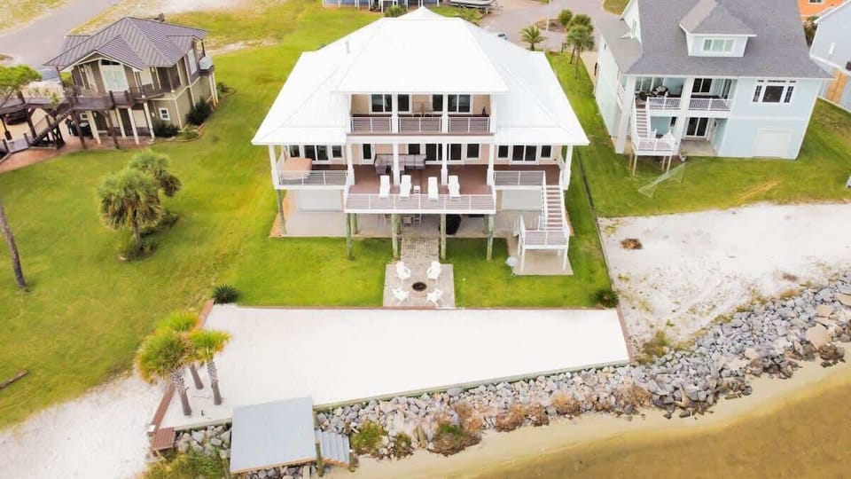 Featuring two spacious decks with comfortable loungers, a new platform that extends out toward the water for easy access, and outdoor seating with a grill — the perfect setup for relaxing by the shore and enjoying meals with a view.