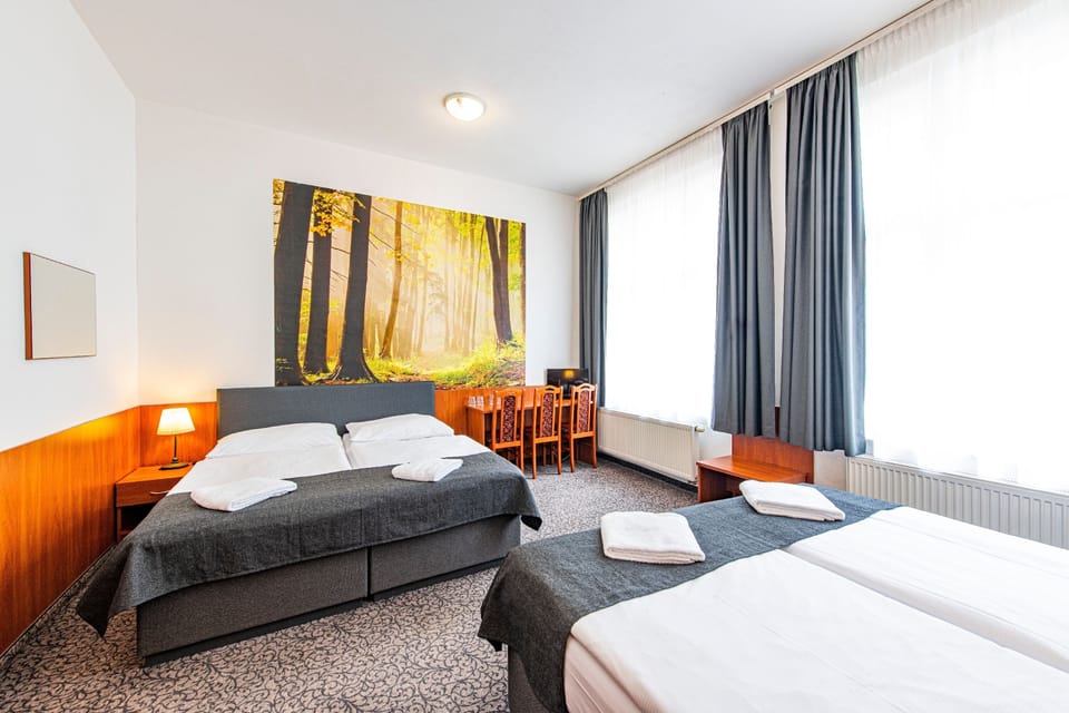 Standard Quadruple Room | Desk, blackout drapes, free WiFi, bed sheets