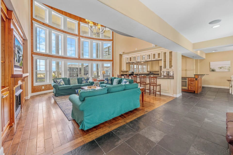 Step outside to the sunny oceanfront deck — accessible through the great room or one of the king masters.
