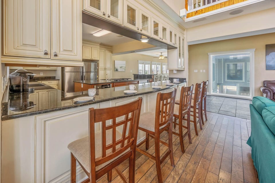 An eat-at counter in the kitchen provides additional seating for 5 people.