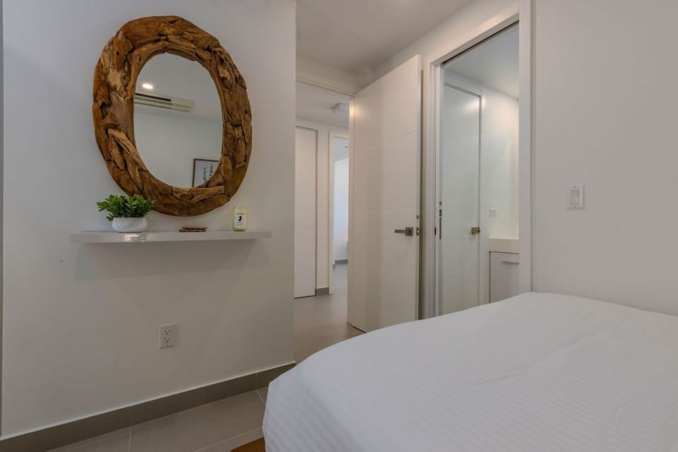 Sink into the plush linens and enjoy your private sanctuary. This serene bedroom features thoughtful details and climate control for your ultimate comfort.
