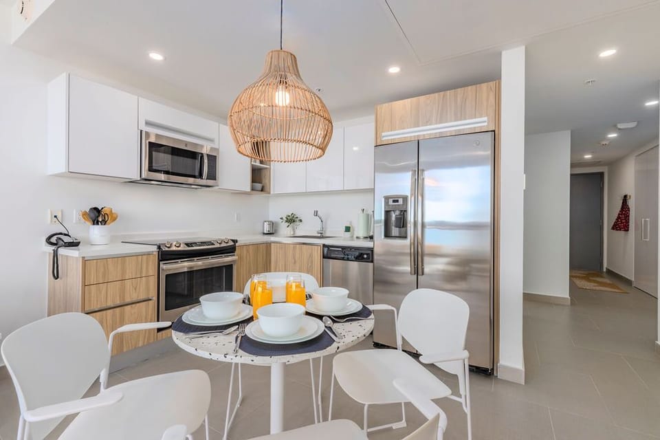 Bright, modern kitchen awaits with stainless steel appliances, ample counter space, and a cozy breakfast nook perfect for morning coffee and planning your day's adventures.