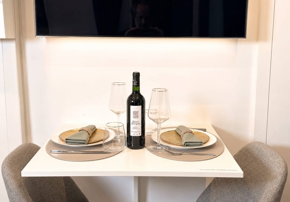 Cozy dining table, wine bottle included