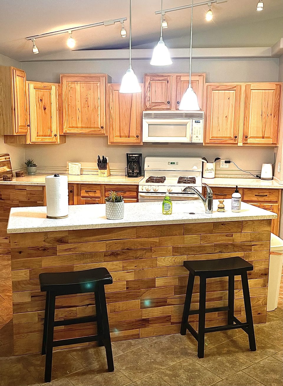 kitchen stocked with necessities, pots/pans, utensils, bowls/plates
