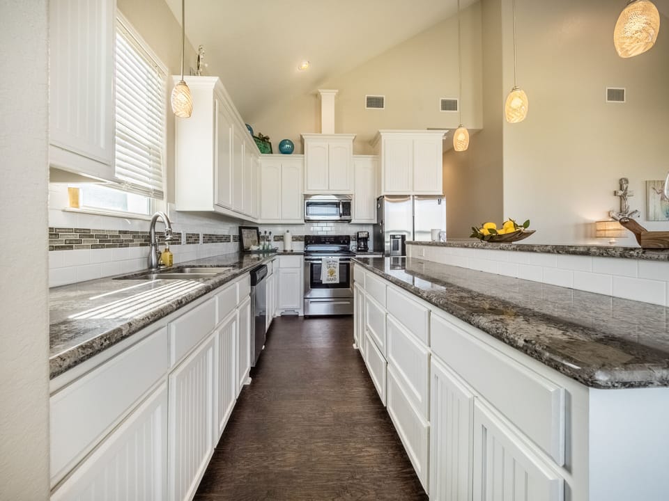 All upgrades in fully stocked kitchen including granite, stainless & misc xtras