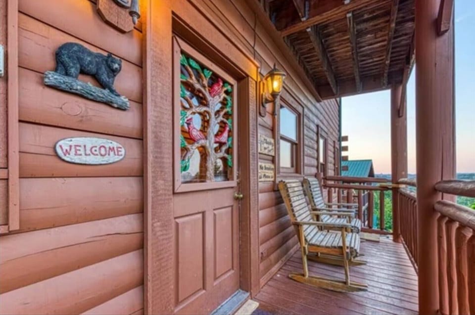 Step past the carved bear and the welcome sign into your home base for the week. Keypad entry means no key handoffs, ever.