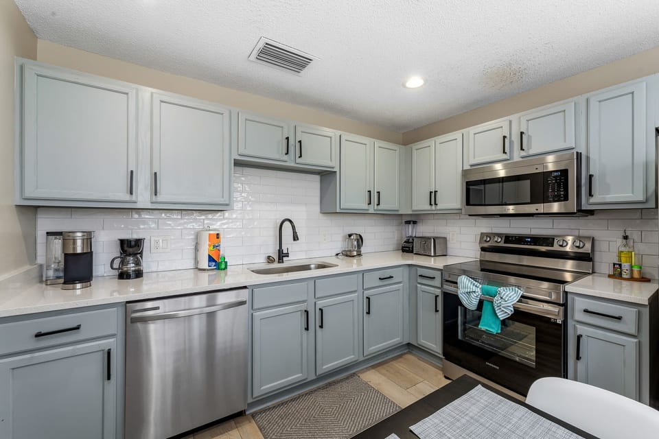 Spacious kitchen w/ ample cabinetry, open layout, and room to gather.