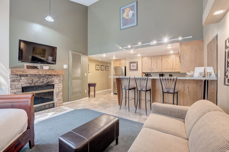 Living Area with King Bed and Sleeper Sofa / Kitchen