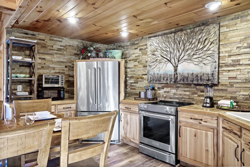 Kitchen with stainless refrigerator. Ice maker in the lower freezer tray.