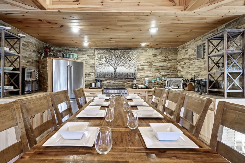 Full kitchen with seating for 8. Pots, pans, plates, glasses, cookie sheets, etc