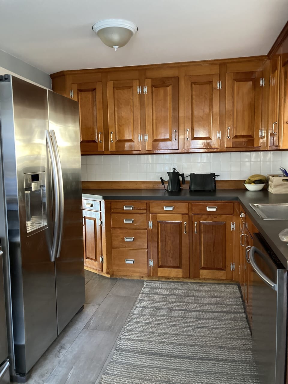 kitchen with stove, fridge, microwave, oven and ample appliances