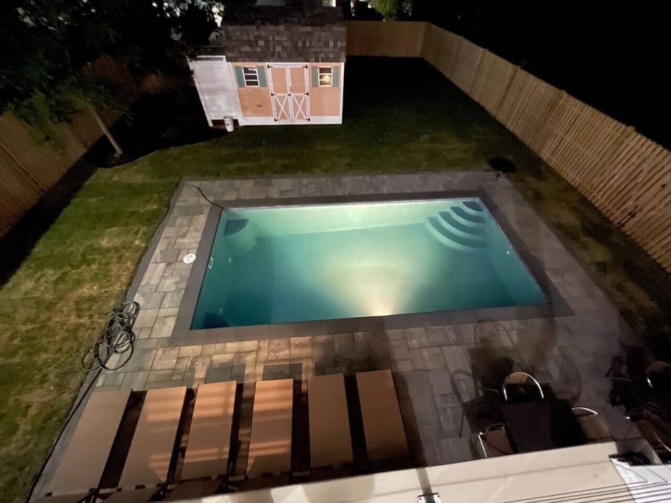 Night view of backyard from 2nd floor deck.