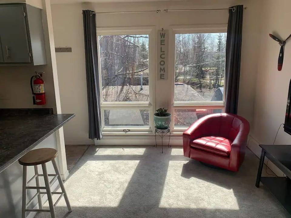 Cheerful window overlooking a charming neighboring courtyard area. 