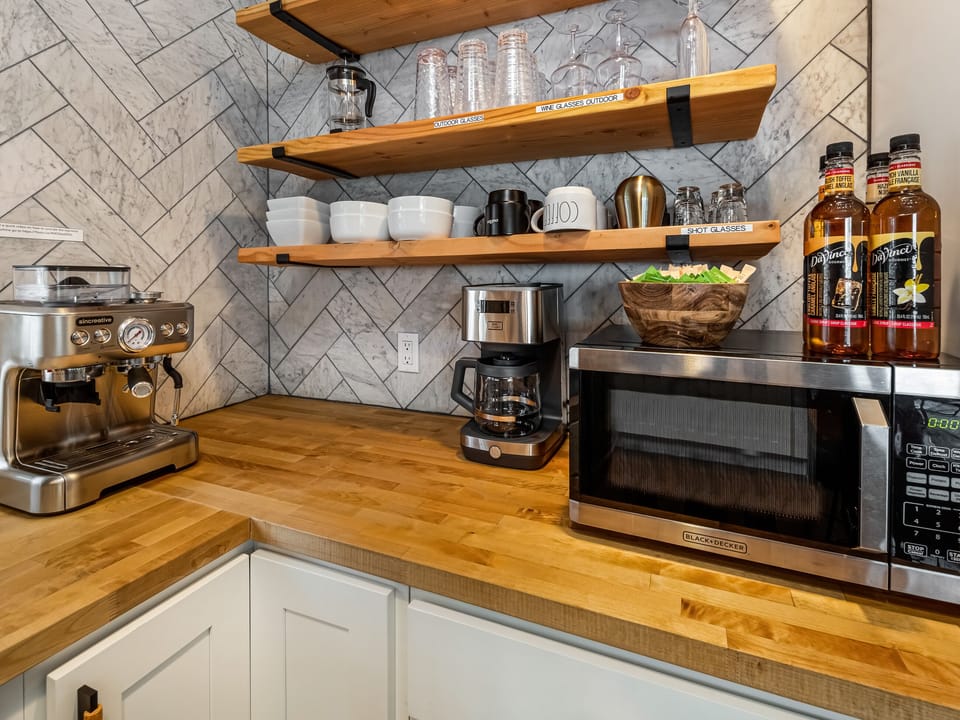 In addition to the teapot, French press and coffee maker, craft your own cafe-style drinks with a Barista Espresso machine. A coffee grinder is supplied as well as whole espresso beans in addition to a few flavored syrups.