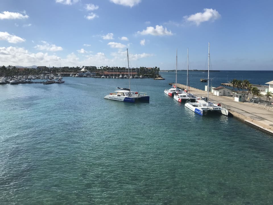 Sink into plush bedding and let the bright coastal artwork transport you to nearby beaches. Step through sliding glass doors to your private balcony overlooking the area below.