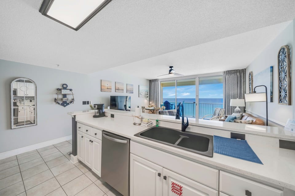 The fully equipped kitchen features quartz countertops, stainless-steel appliances, and has everything you need to prepare meals for family & friends.