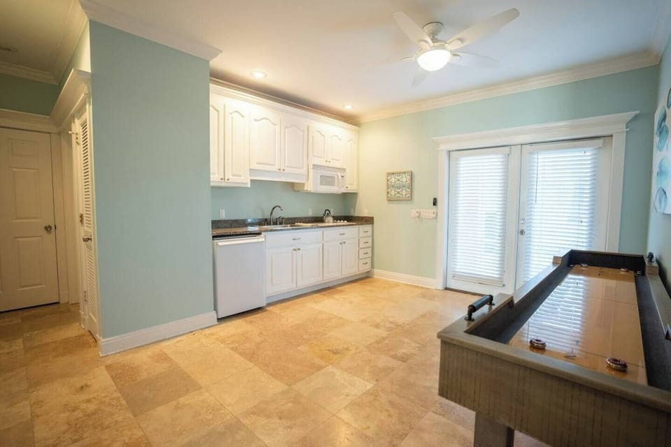 First floor sitting room and kitchenette.  The hallway to the left leads to the Queen bedroom and full bathroom.