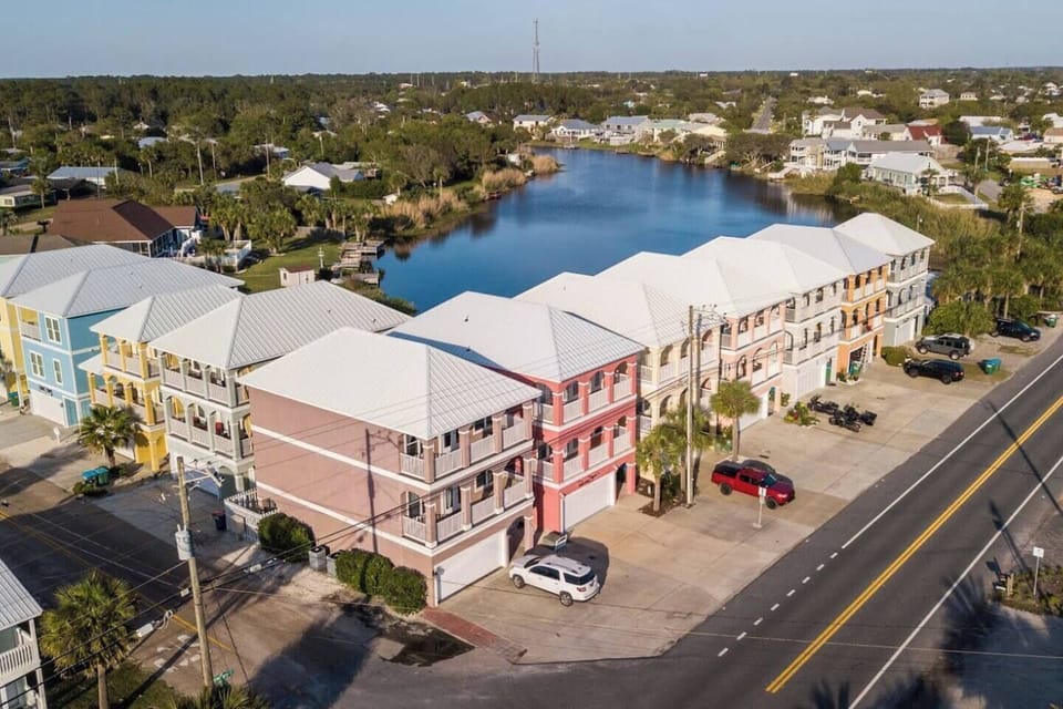Drone view of Riviera Beach Villas and Panama Jane's and the dune lake behind.