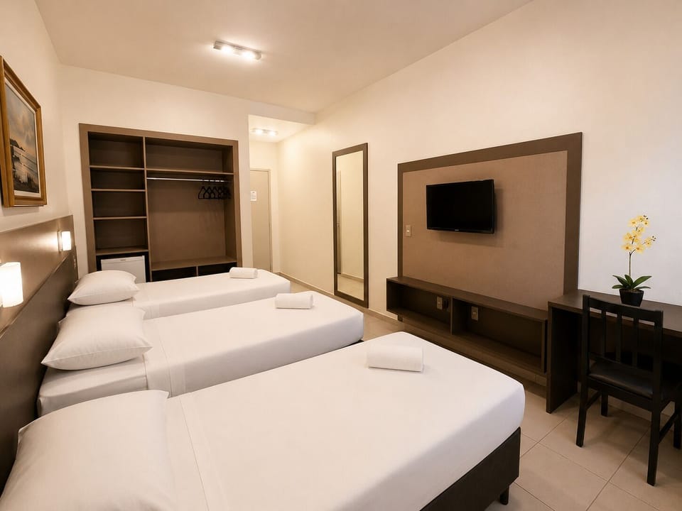 Deluxe Triple Room, 3 Twin Beds | Minibar, desk, WiFi (free), bed sheets