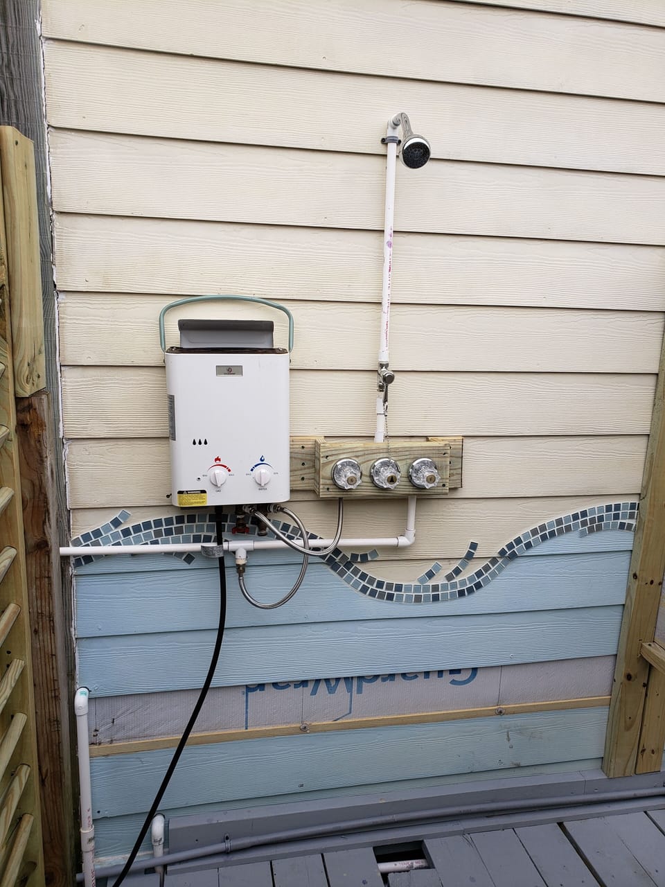 Outdoor shower with a water heater